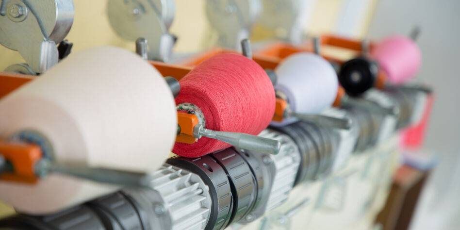 Textile industry with knitting machines in factory