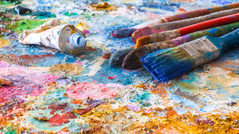 oil paints and paint brushes on a palette
