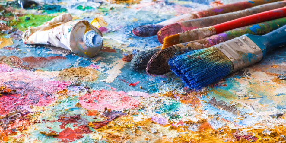 oil paints and paint brushes on a palette
